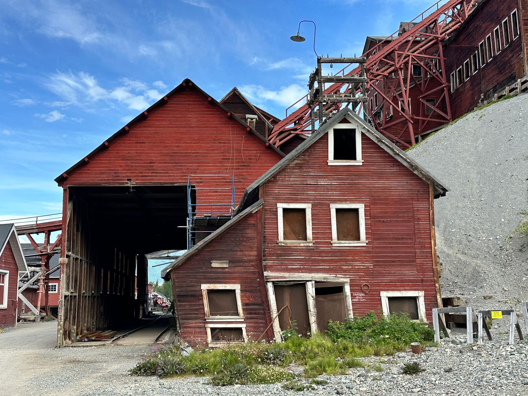An abandoned red building showcasing historical industrial architecture