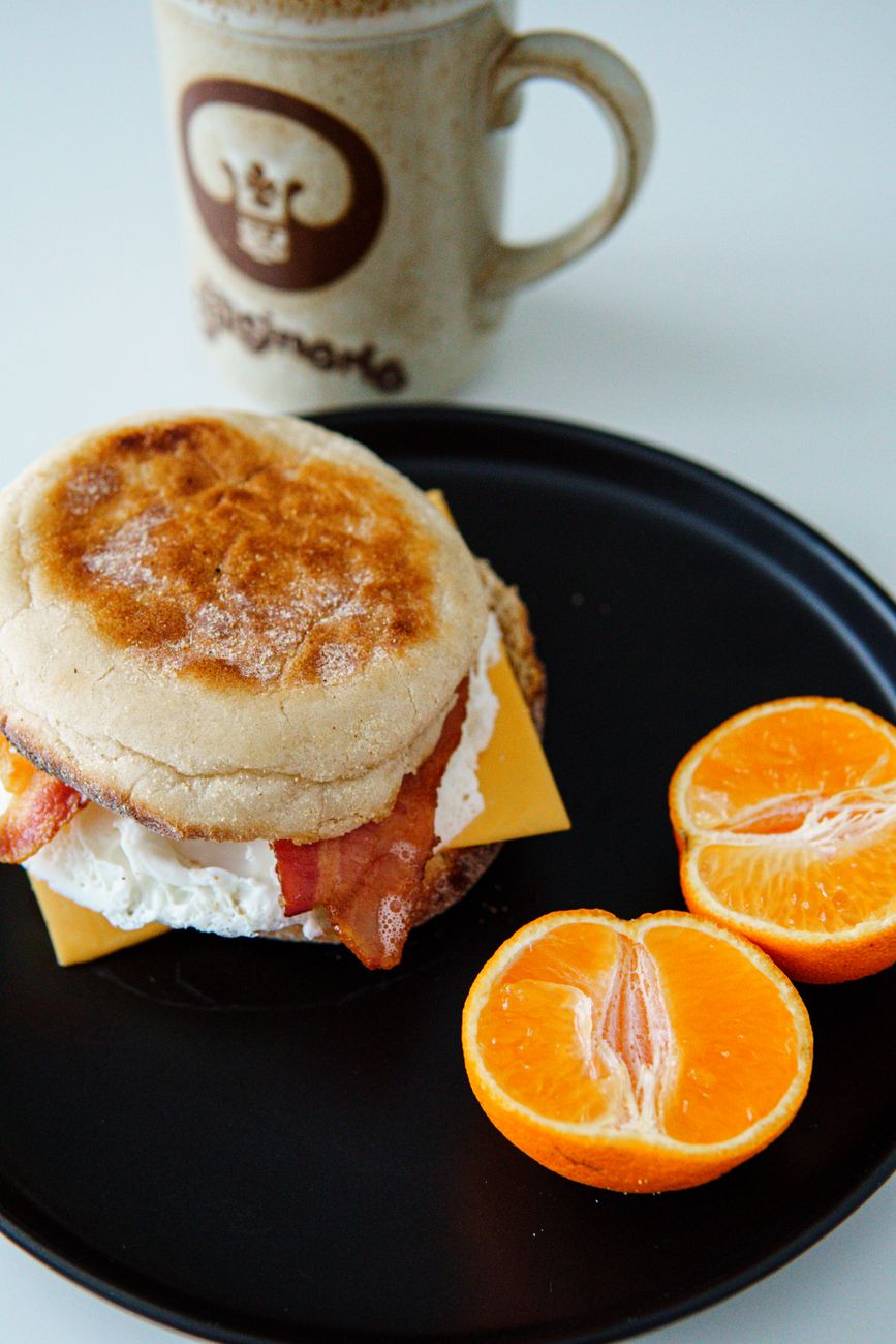 Tasty breakfast with a bacon, egg, and cheese muffin