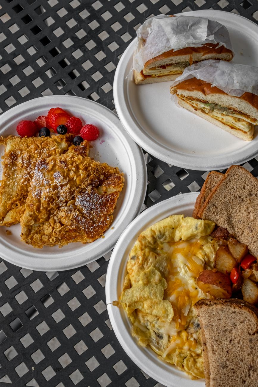 A spread of hearty breakfast meals arranged on a table