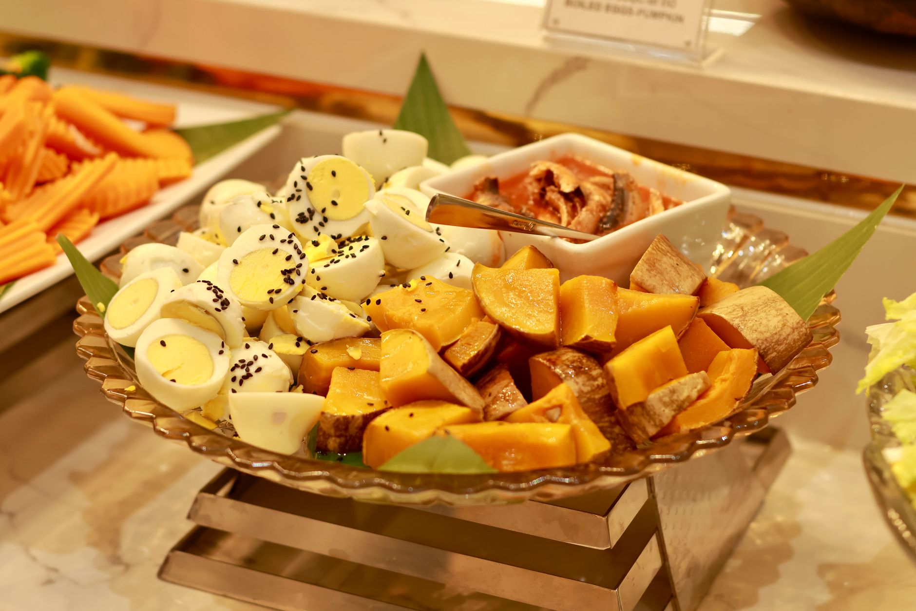 An appetizing buffet platter featuring eggs and fresh vegetables