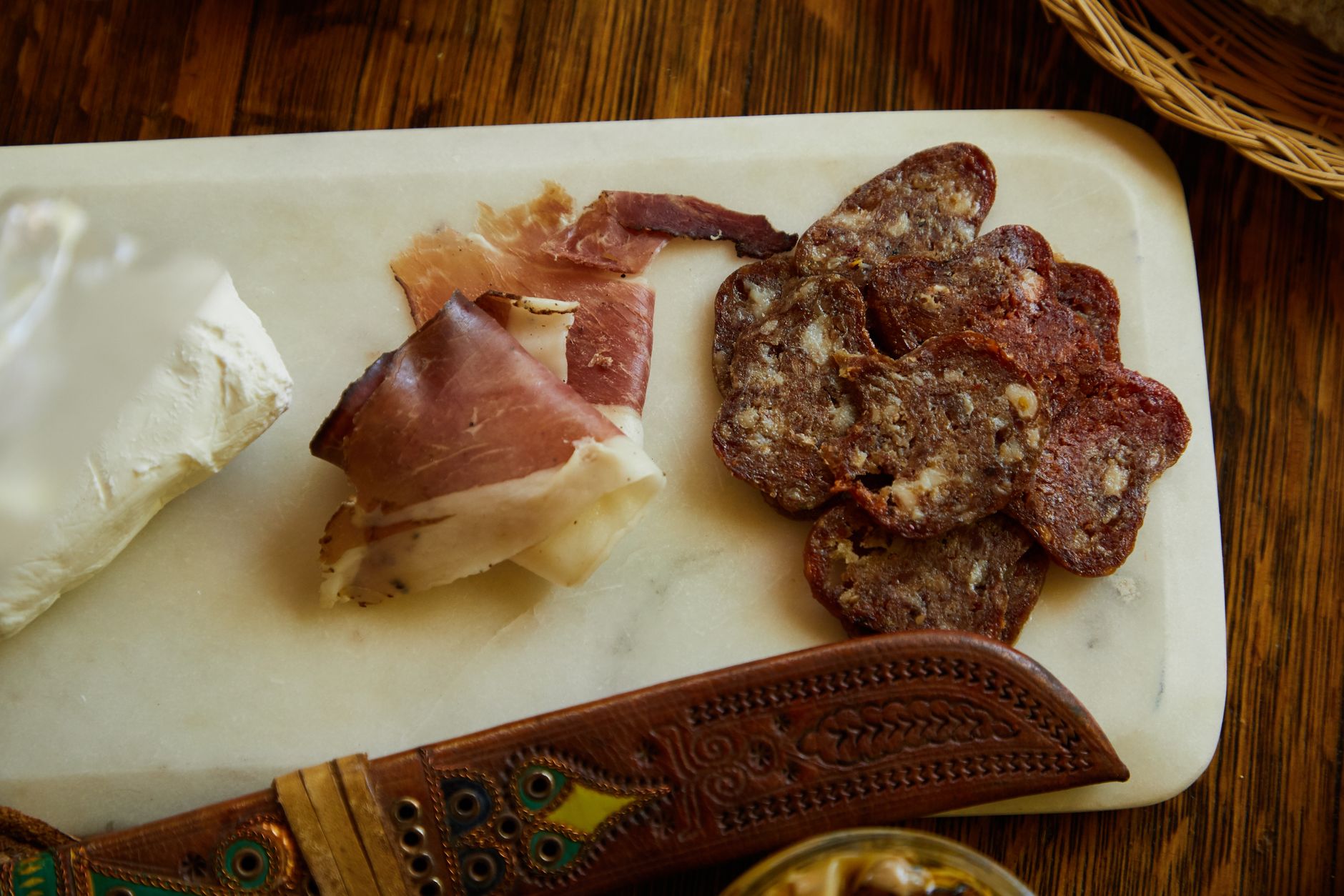 Top view of an appetizing charcuterie platter featuring salami slices