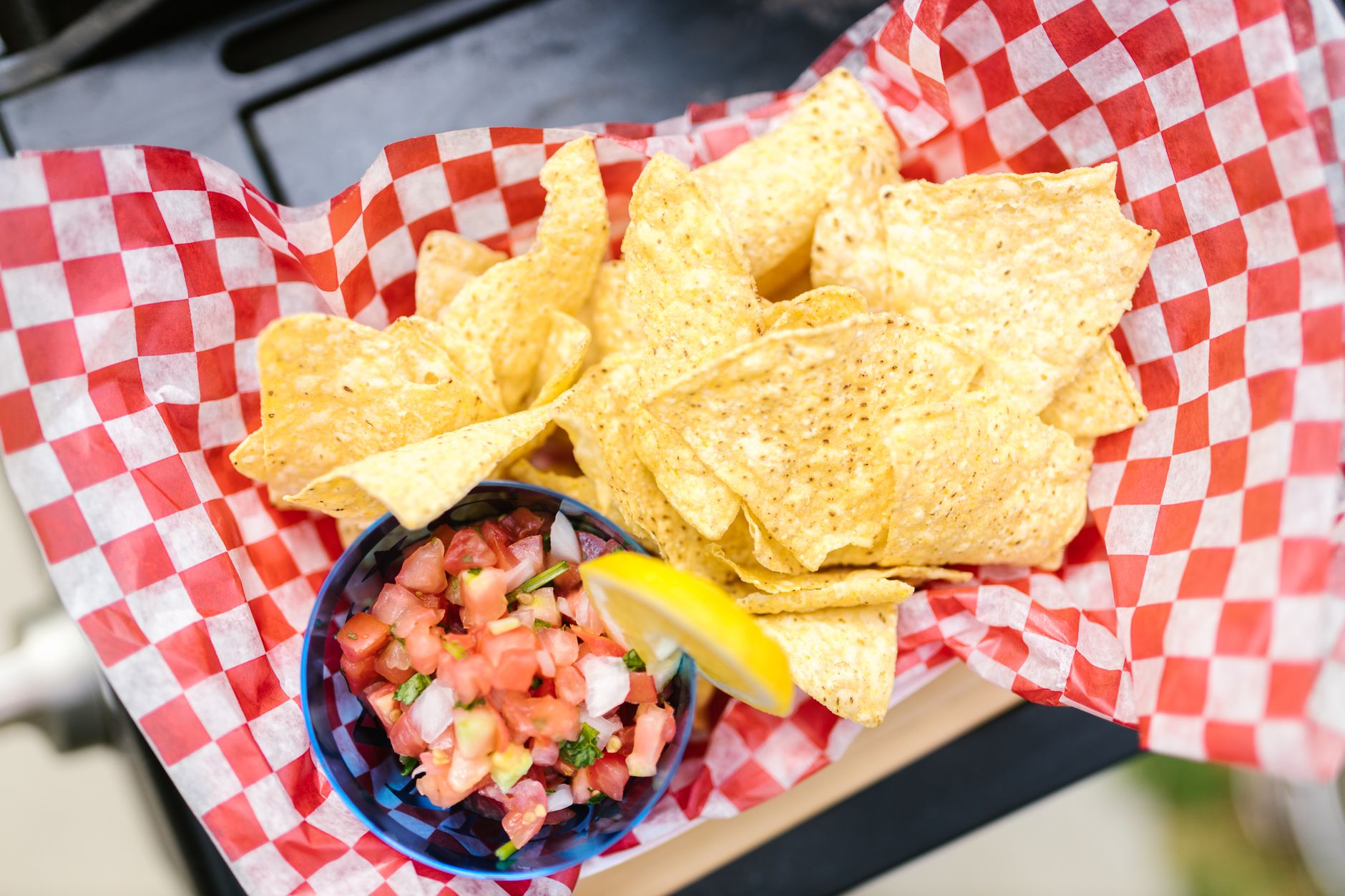 Crispy nachos served with fresh, colorful pico de gallo and lime