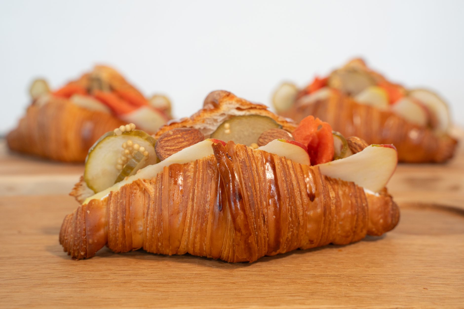 Delicious croissant sandwiches with fresh pickles and veggies