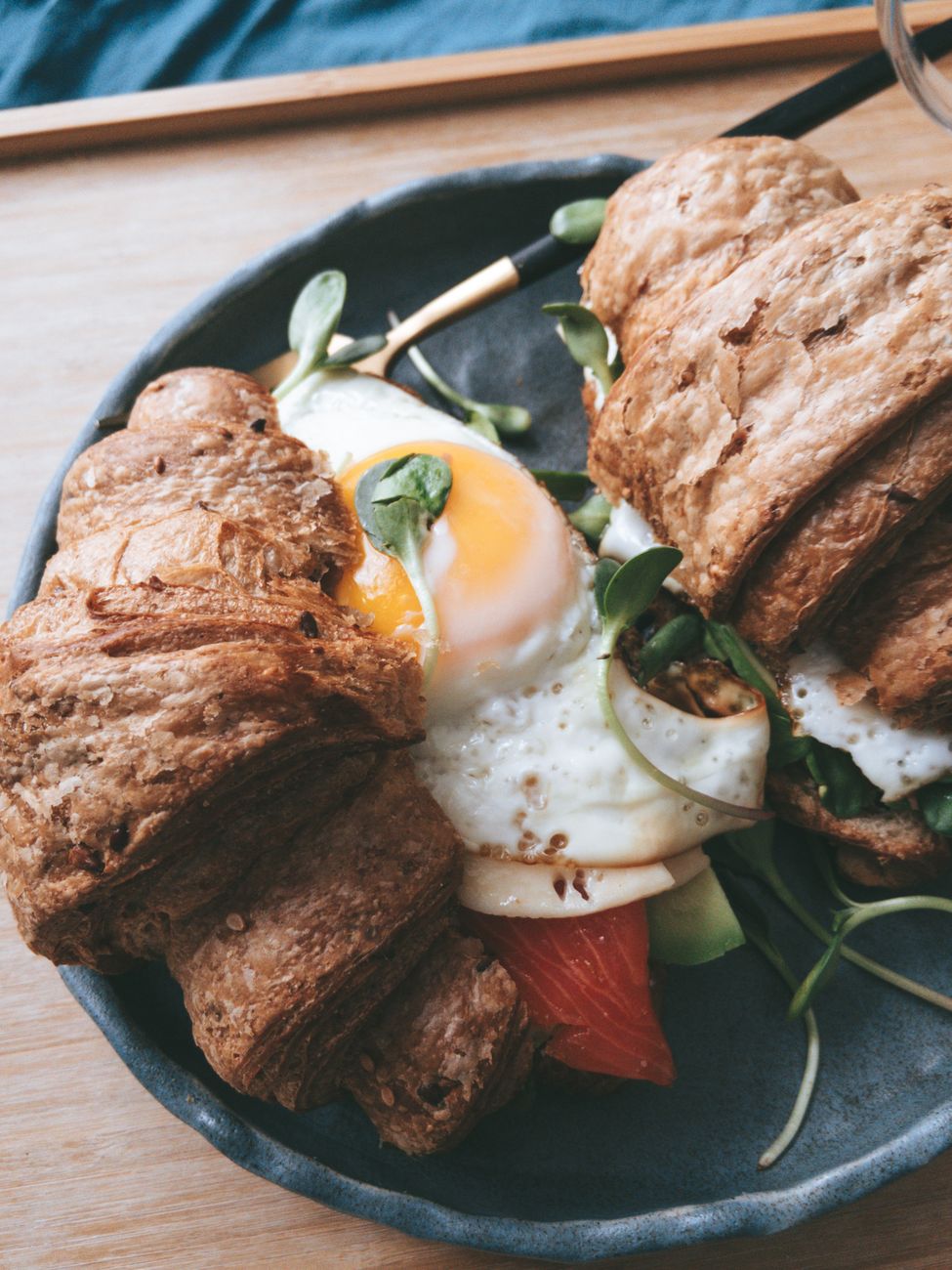 Close-up of croissants with egg and vegetables