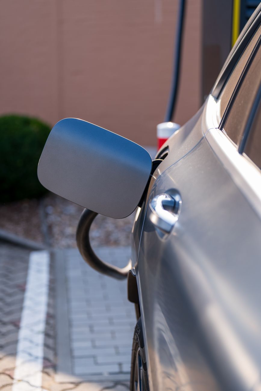 Close-up of an electric car being charged at a charging station