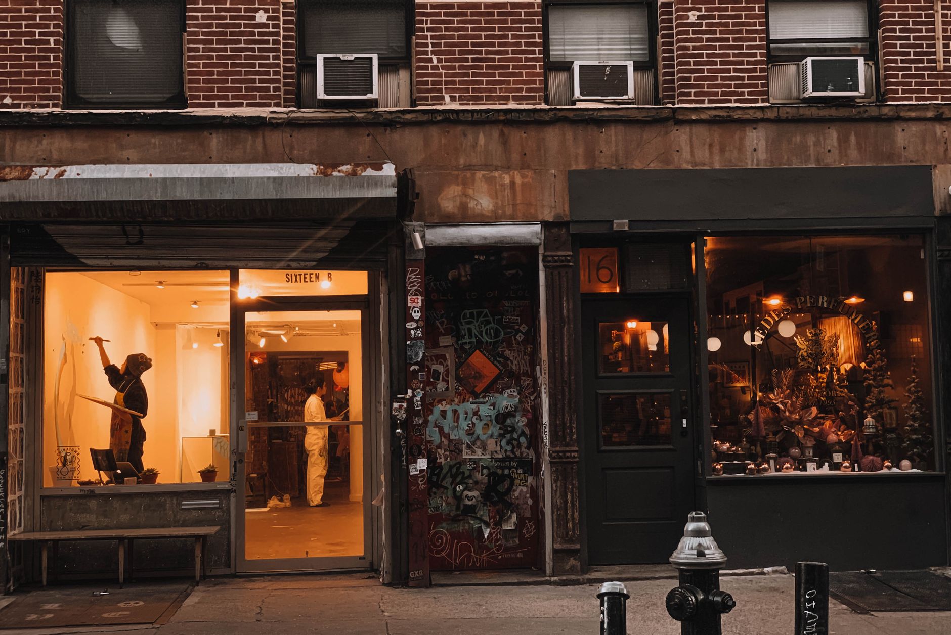 Charming evening view of a downtown storefront featuring art