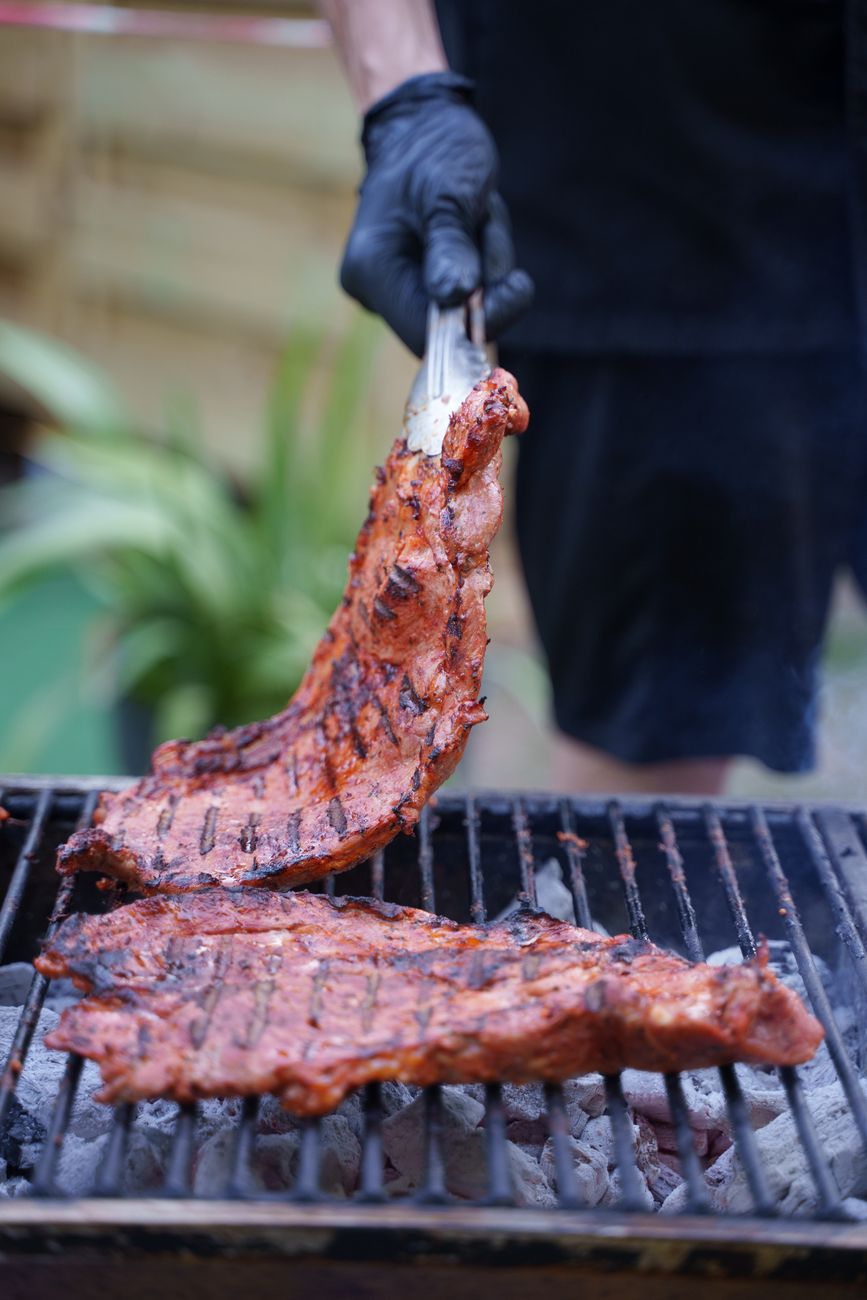 A close-up view of food grilling over open flames