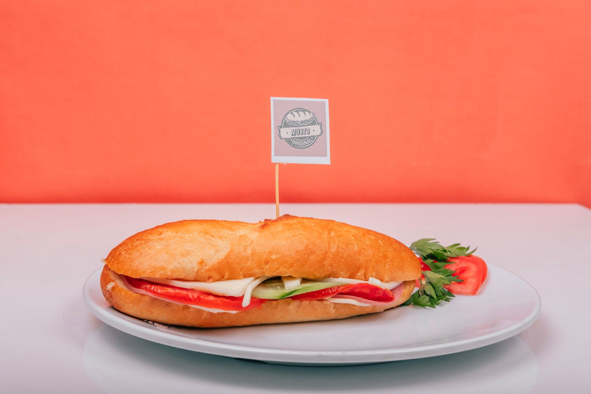 A fresh sub sandwich filled with veggies on a plate