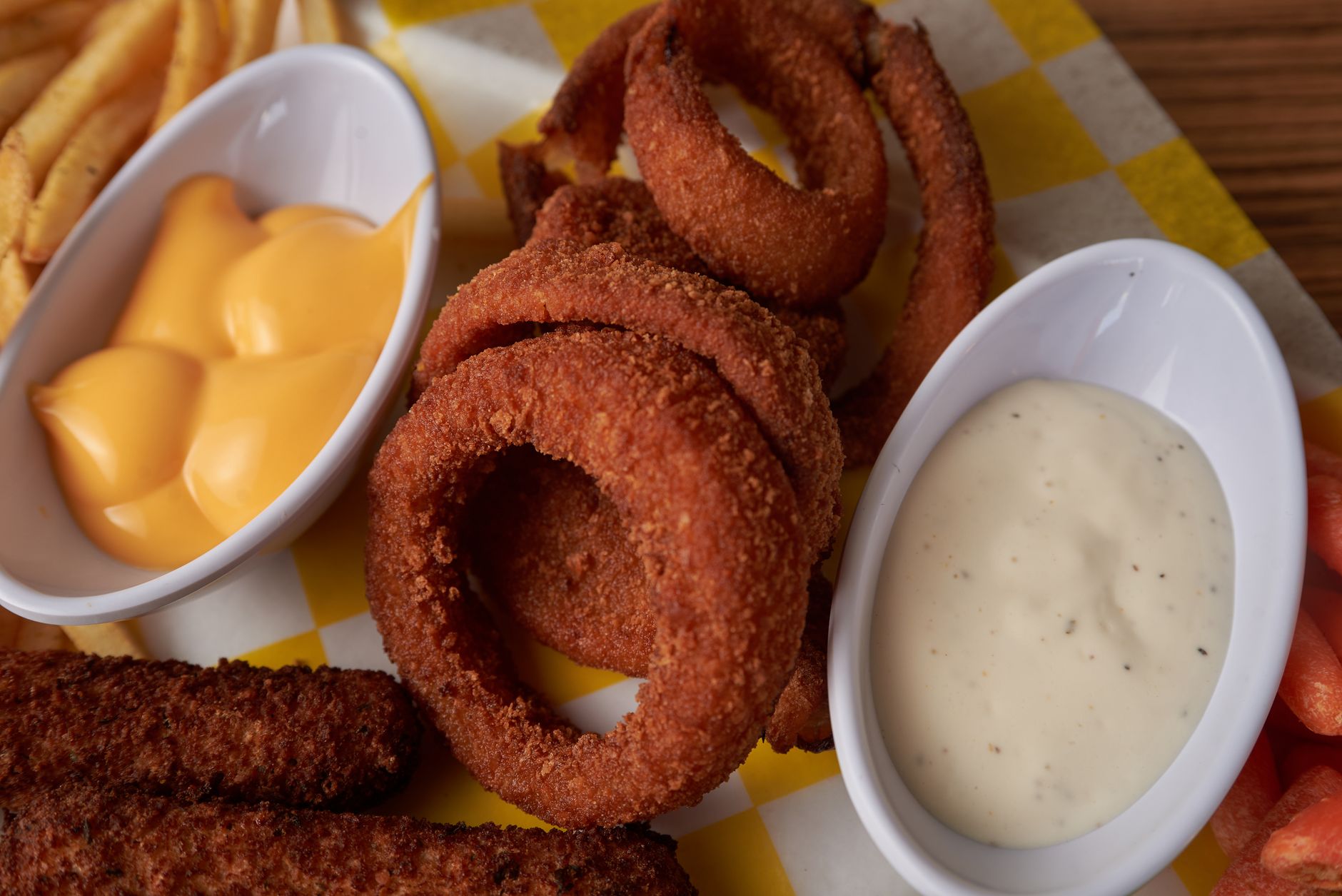 Crispy fried onion rings served with a creamy dipping sauce