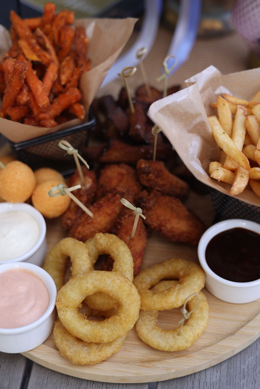 Various fried snacks served with three different dipping sauces