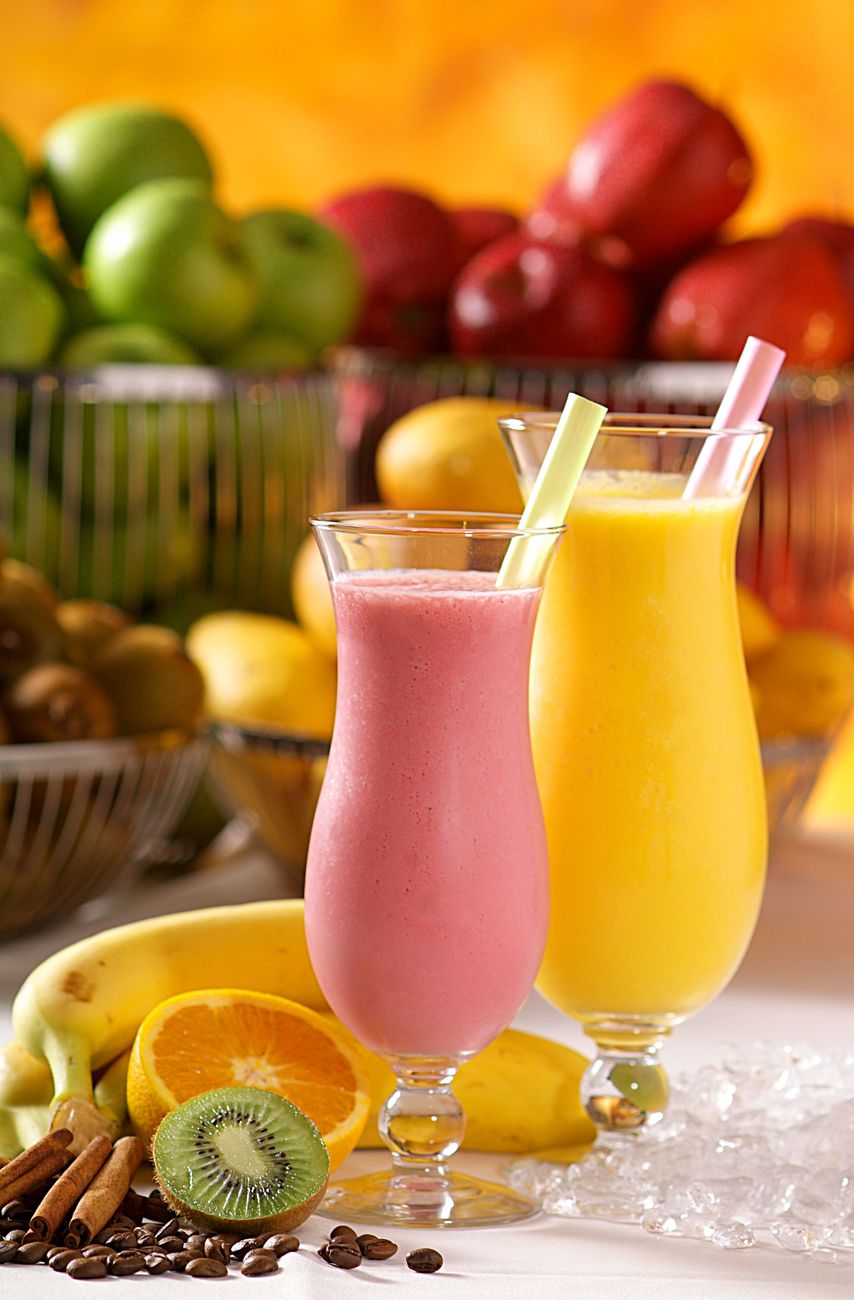 Vibrant smoothies made from fresh bananas, kiwi, and oranges