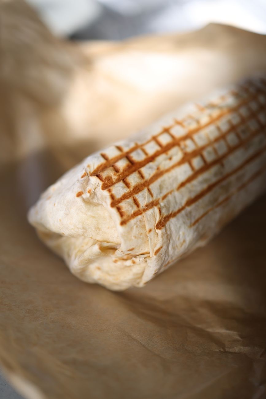 Close-up of a freshly grilled wrap with toasted marks