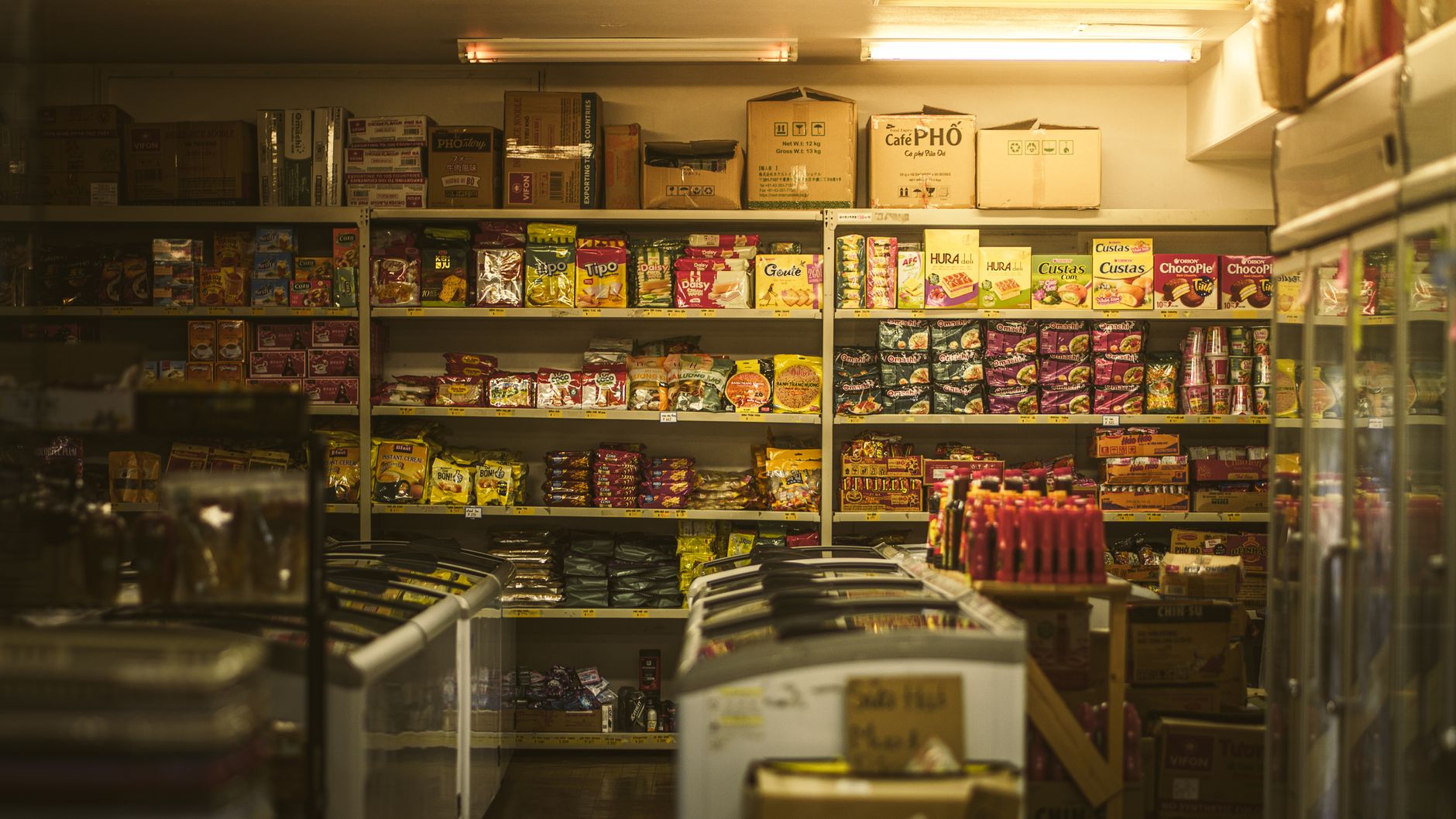 Shelf packed with a variety of snacks in a store