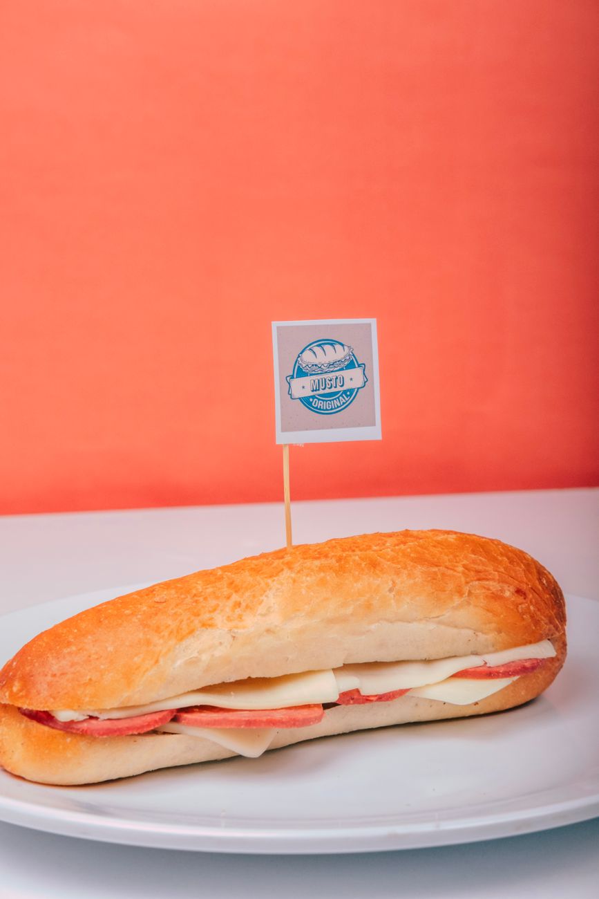 Fresh ham and cheese sub sandwich on a plate