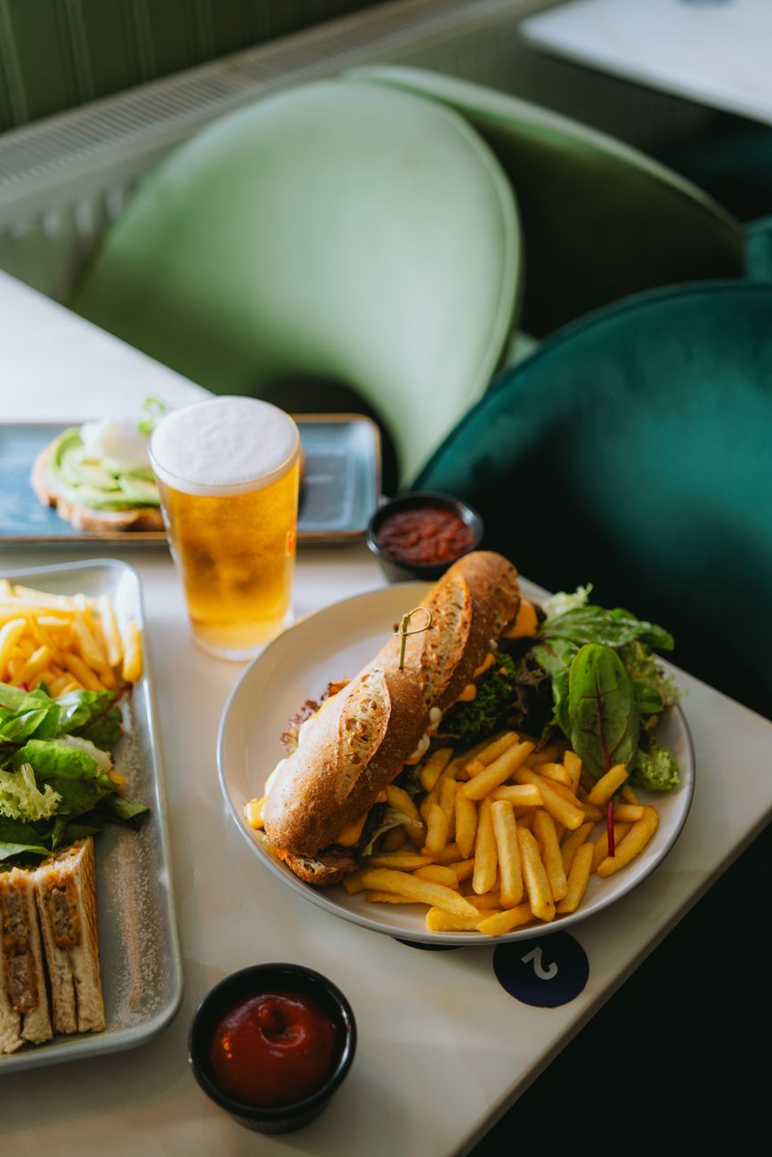 A hearty sandwich meal served on a wooden table