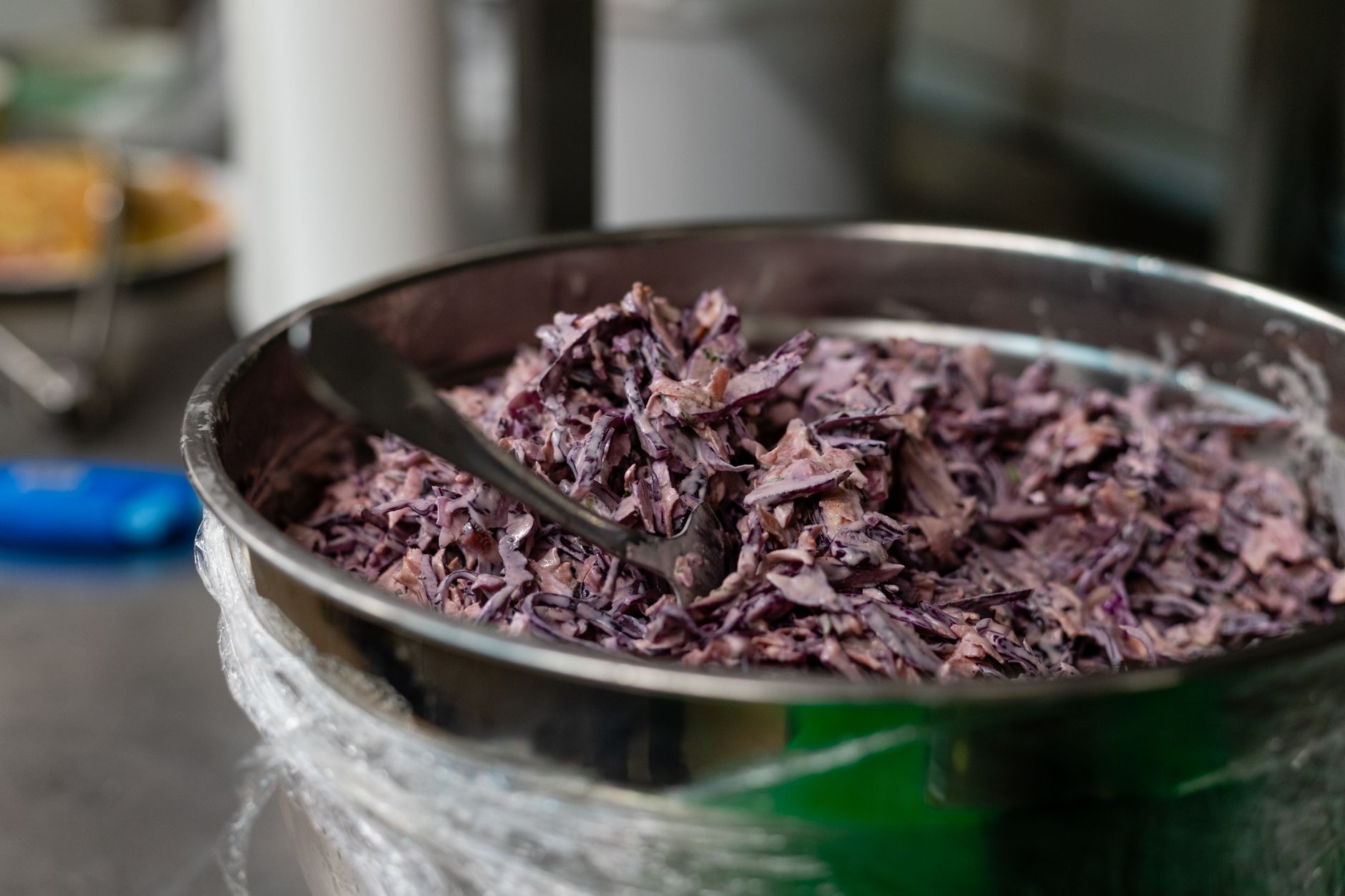 Delicious homemade coleslaw in a metal bowl, perfect for summer picnics
