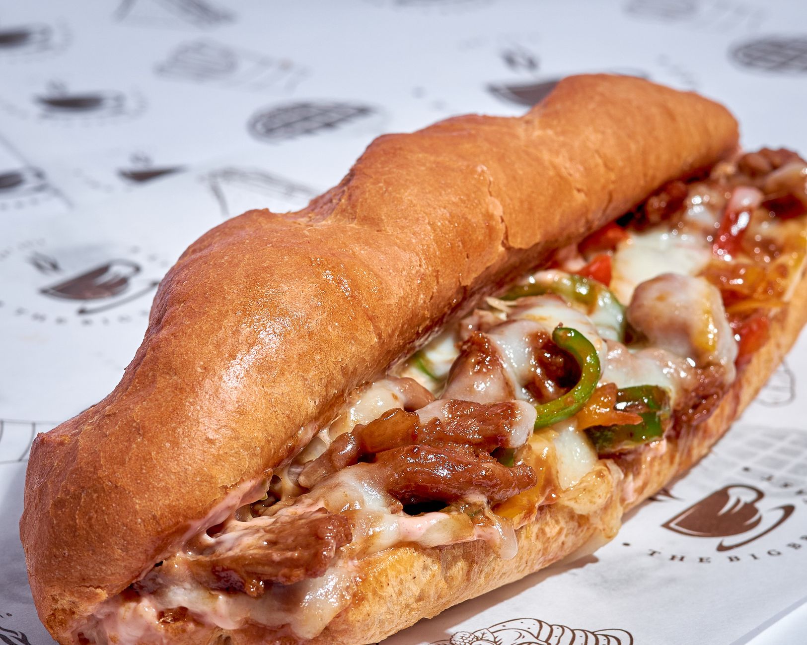 A mouthwatering Italian sub sandwich filled with melted cheese and fresh ingredients