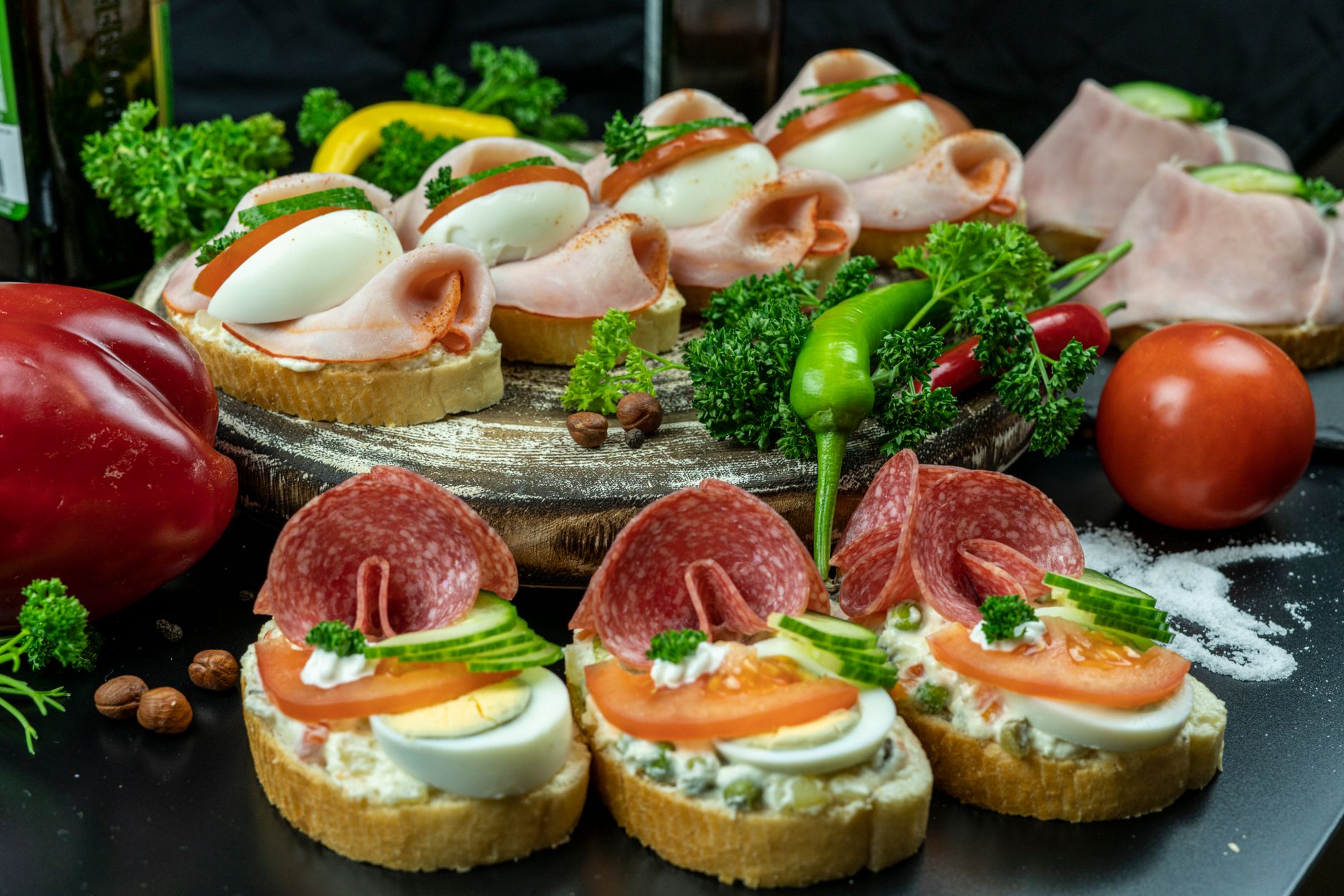 Assorted sandwiches arranged neatly on top of a table
