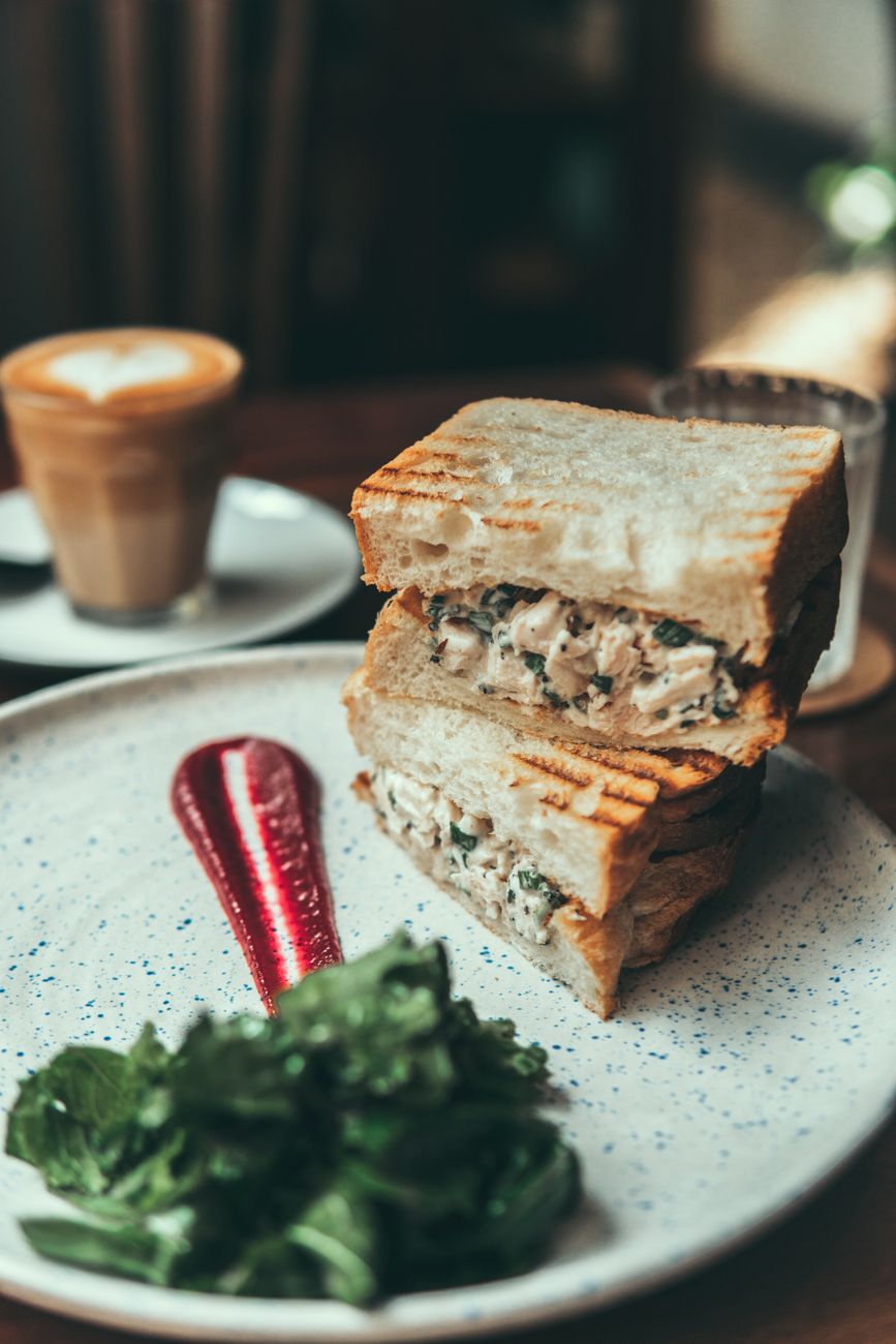 A delicious toast topped with tuna fish and sauce on a table