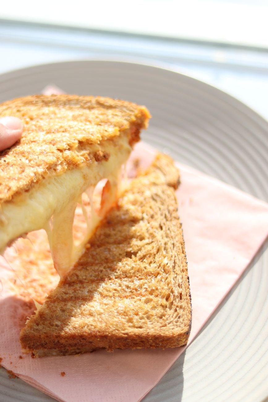 Deliciously toasted grilled cheese sandwich with melted cheese