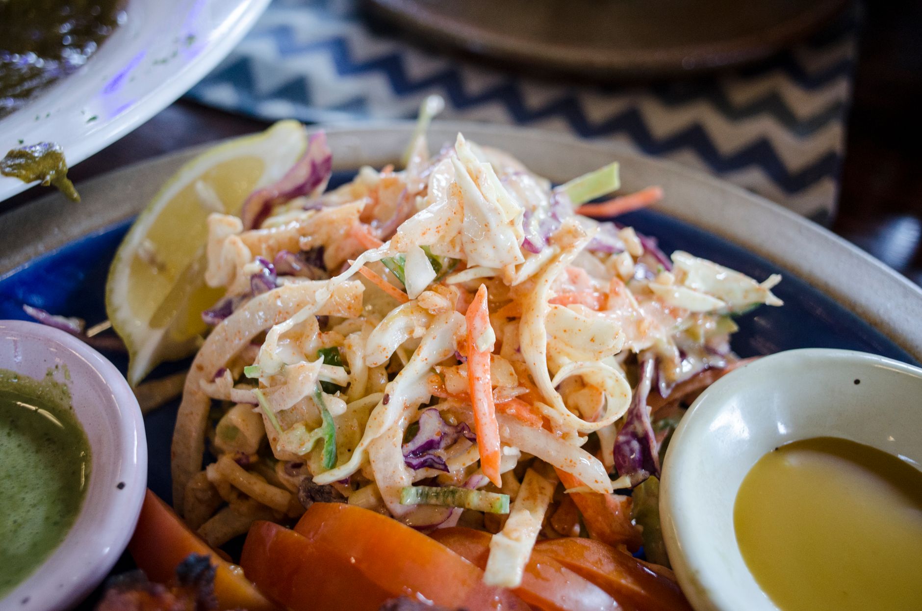 A vibrant and healthy vegetable salad with lemon and dressing